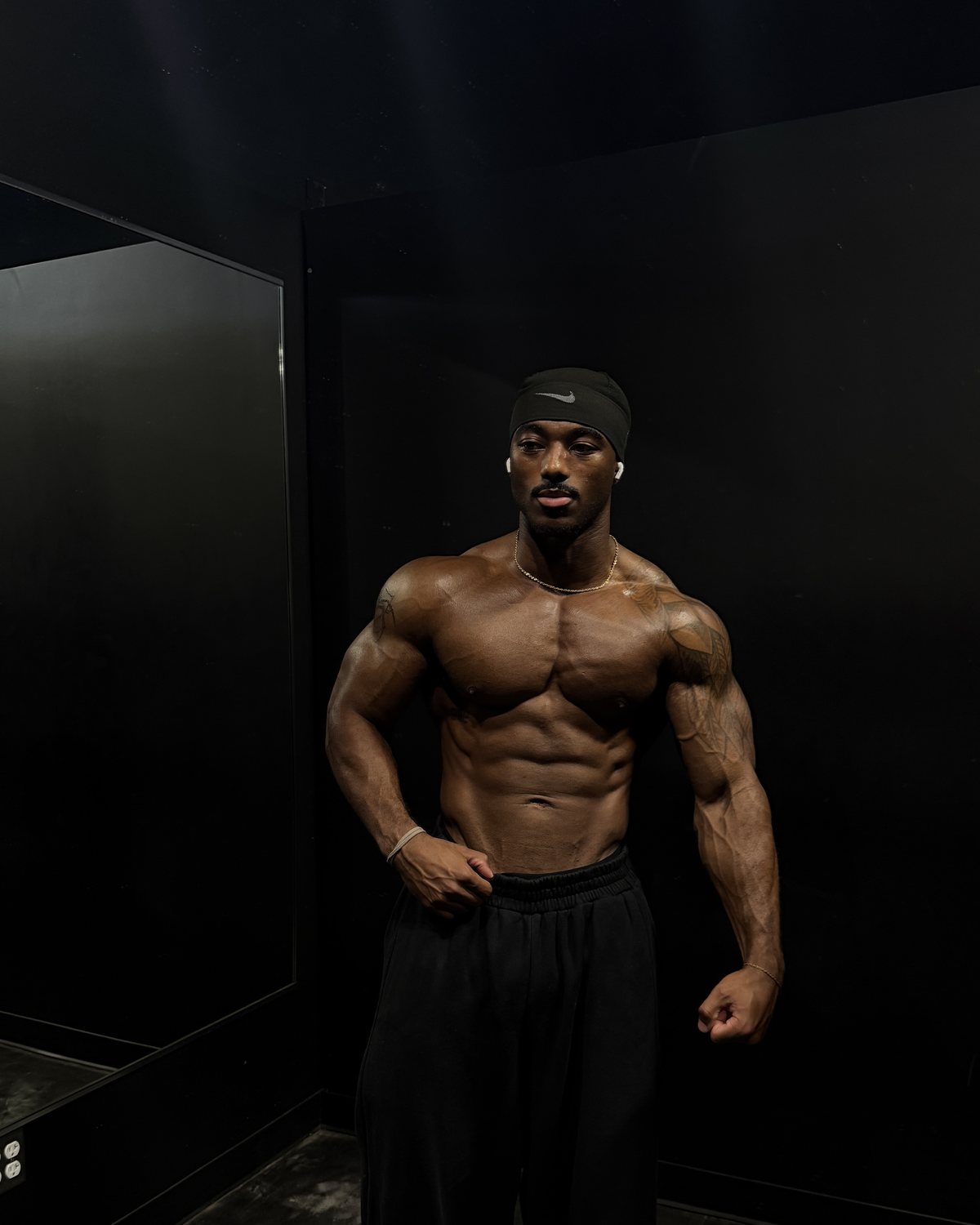 Edward Banks standing in the gym mirror