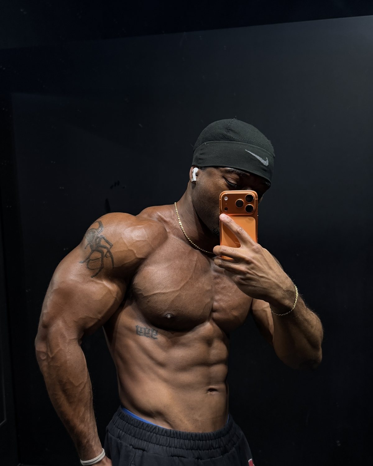 Edward Banks, side flex in the gym mirror